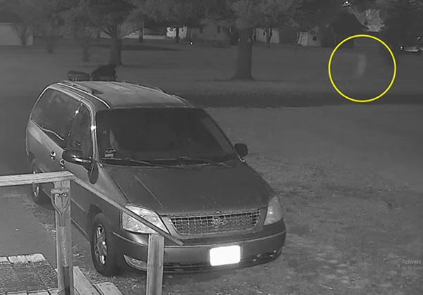 Security Camera Captures 'Ghostly Figure' Walking Along Road